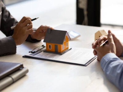 Real estate agent discuss about the terms of the home purchase agreement and asked the customer to sign the documents to make the contract legally, Home sales, lease, mortgage and home insurance.